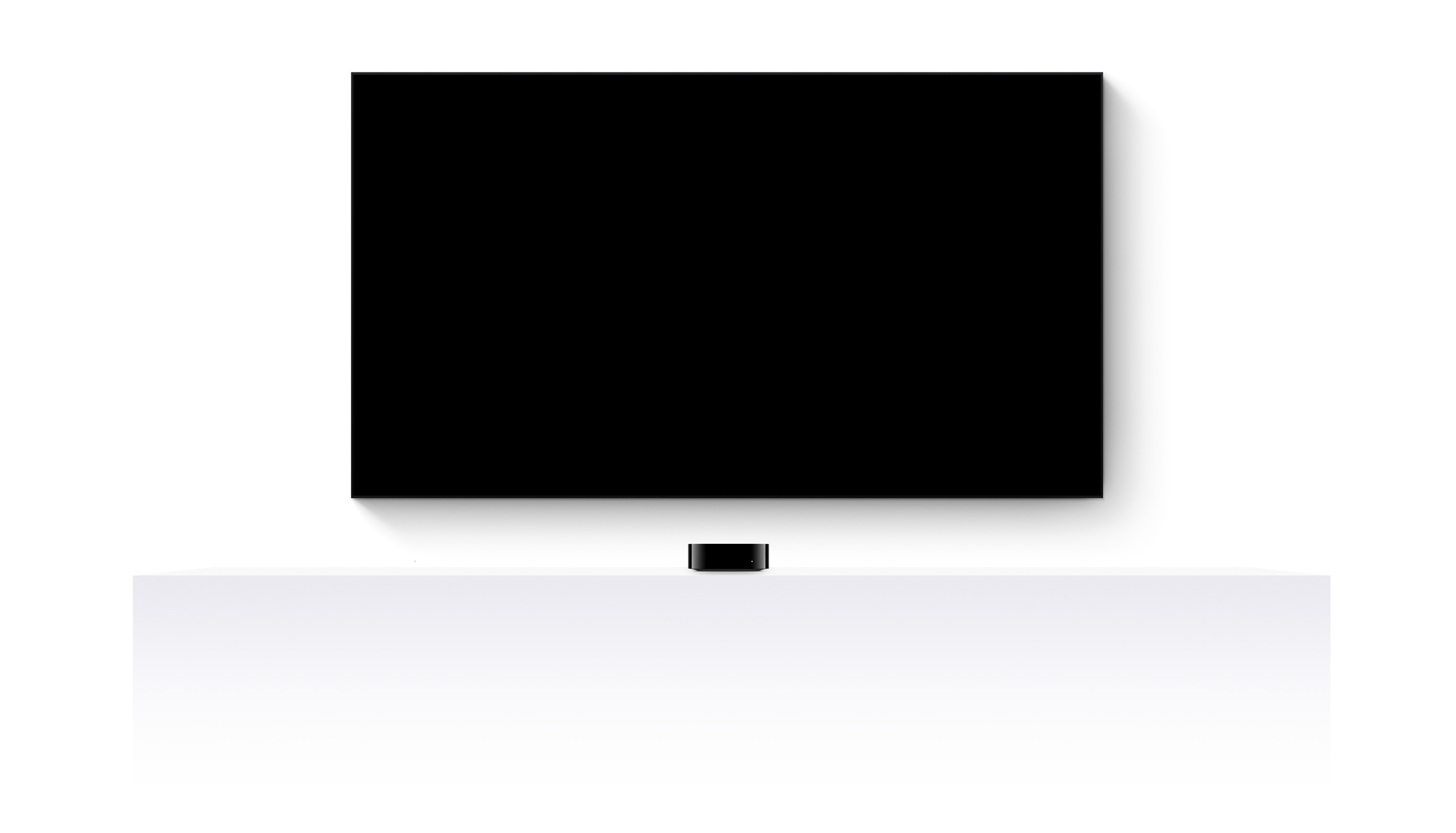 Un Apple TV 4K y un televisor de pantalla plana muestran un tráiler editado de varias películas y series de Apple TV