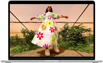 MacBook Air screen showing photo of person in colorful outfit, demonstrating color range and resolution of Liquid Retina display