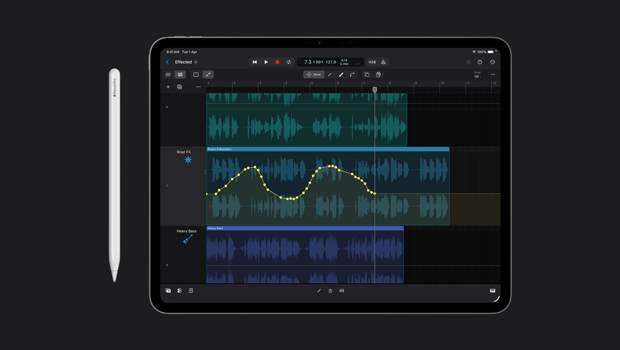 iPad Pro 13 screen workspace showing drawing over the sound wave in Logic Pro, Apple Pencil to the left of device