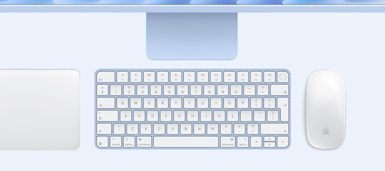 Overhead view of iMac with Magic Trackpad, keyboard, and mouse