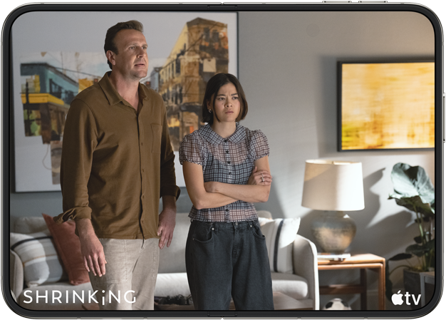 iPhone Duo, opened in horizontal position, Apple TV show 'Shrinking' plays on screen