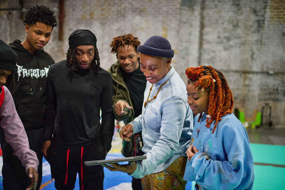 Arts New Orleans’ Journey Allen with participants of the Young Artist Movement.