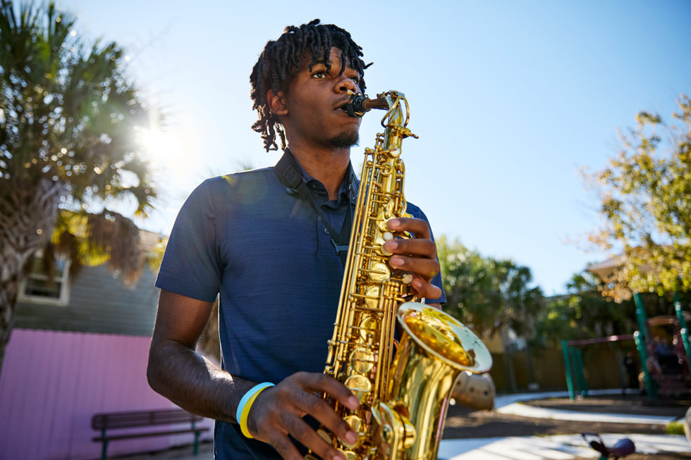 Ellis Marsalis Center for Music participant Jacob Jones Jr plays the saxophone outside the centre.