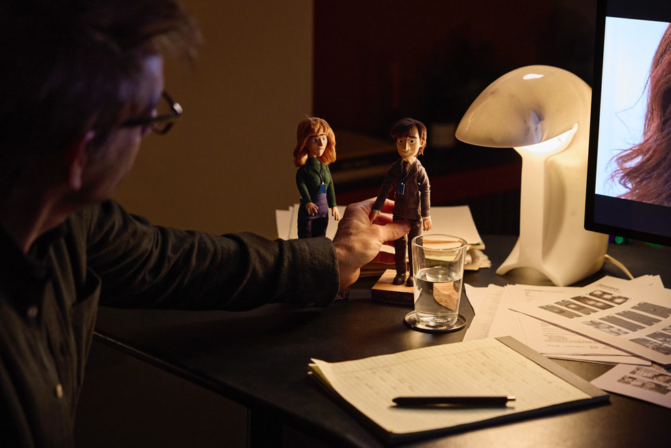 Ben Stiller touches figurines of two main characters from “Severance.”