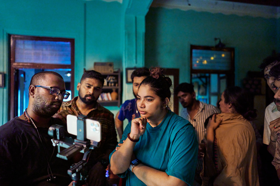 Filmmaker Shalini Vijayakumar (center) and cinematographer Vighneshwar (background left) on the set of Seeing Red.