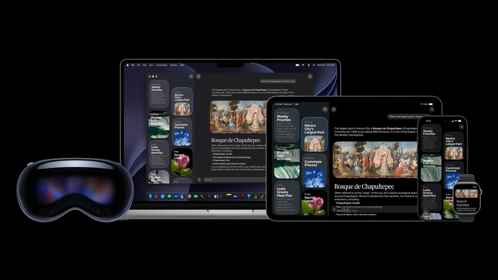 Apple Vision Proと、その横に置かれた新しいSiriアプリが画面に表示されている、開いた状態のMacとiPad。