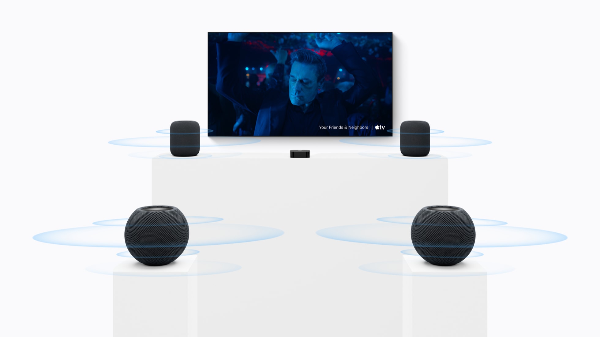 A home theatre setup with two HomePod (2nd generation) speakers in the front and two HomePod mini 2 speakers in the rear.