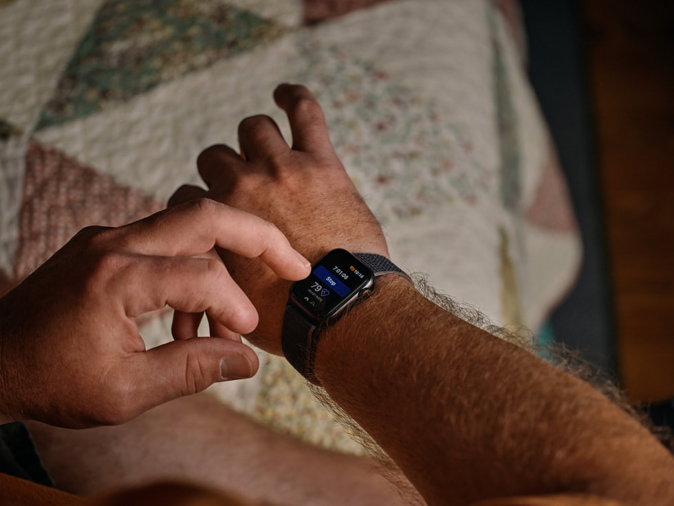 A close-up of Robert Guithues checking his Apple Watch where the Nightvision app is displayed.
