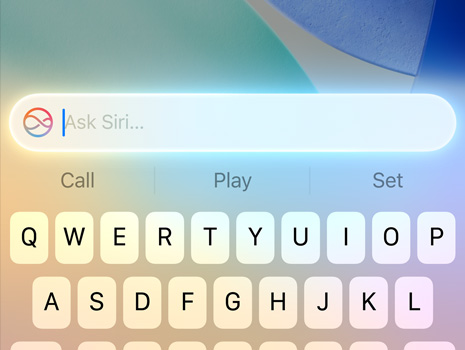 Nahaufnahme eines Cursors bei einer Anfrage an Siri in macOS Tahoe.