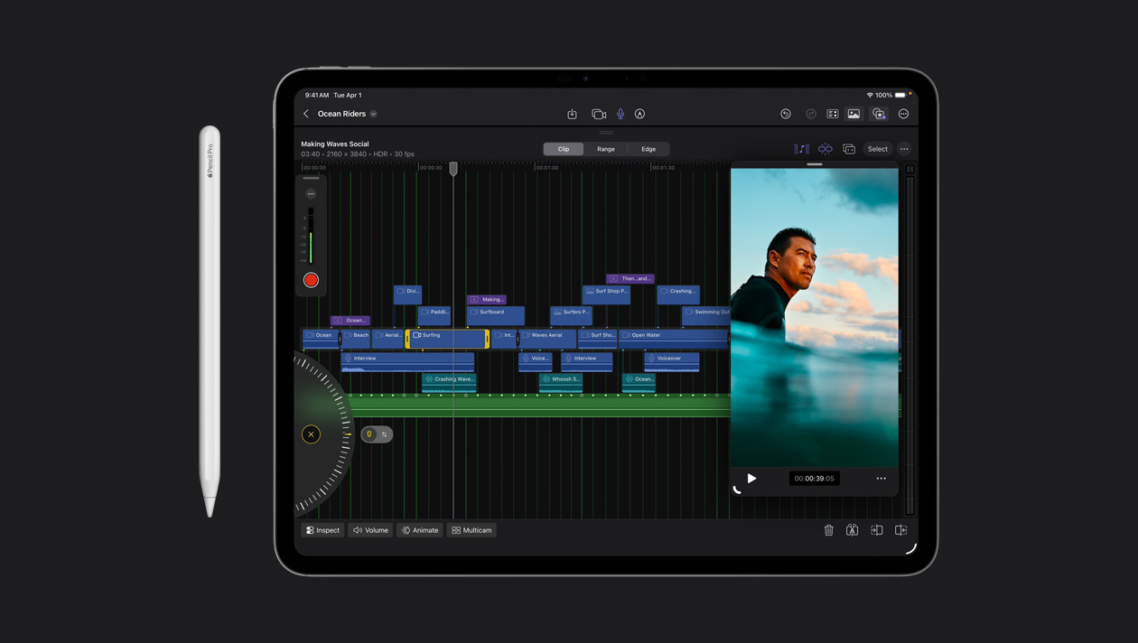 iPad Pro 13 screen showing organized video clips in different colors, image of surfer in the ocean on the right, Apple Pencil to the left of the device
