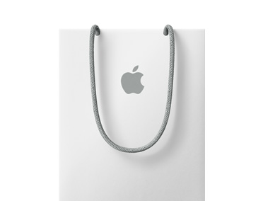 An Apple Store shopping bag, white colour, with grey Apple logo and grey handles