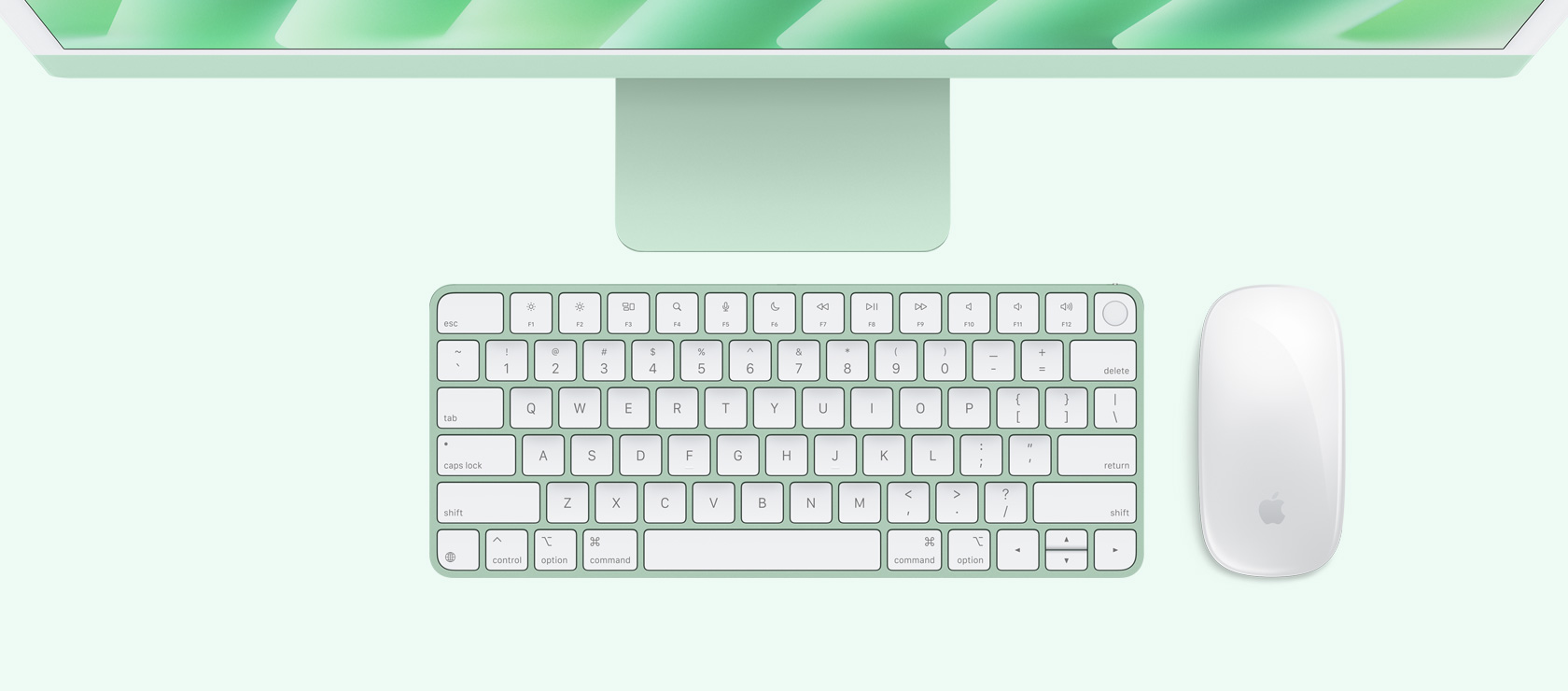 Žalios spalvos „iMac“ vaizdas iš viršaus su spalvą atitinkančia pele ir klaviatūra